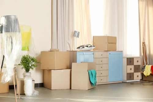 Packed office boxes and furniture prepared for relocation in West Hampstead