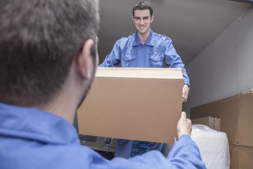 Office removals planning in West Hampstead with moving boxes and workstations