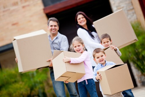 Organised packing materials and labeled moving boxes in Westhampstead