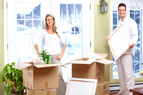 Packed boxes and protected furniture ready for storage or moving