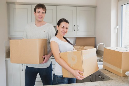 Local moving team organising fragile belongings in West Hampstead